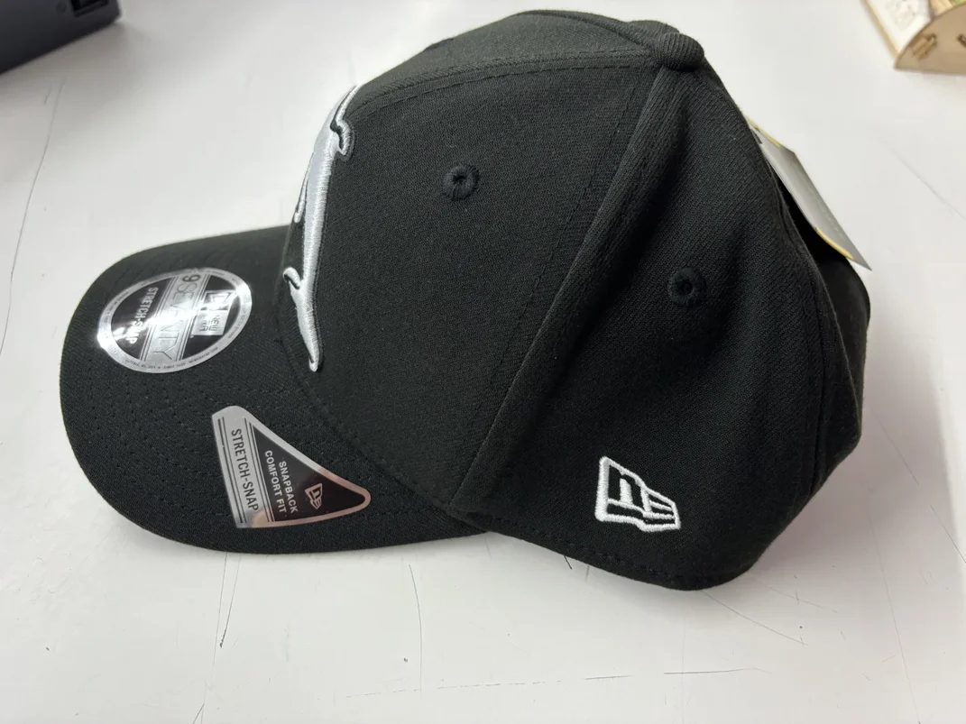 NRL-Dolphins-970SS-Snapback-Cap-Black-White-Left.webp NRL Dolphins 970SS Snapback Cap Black White Left View