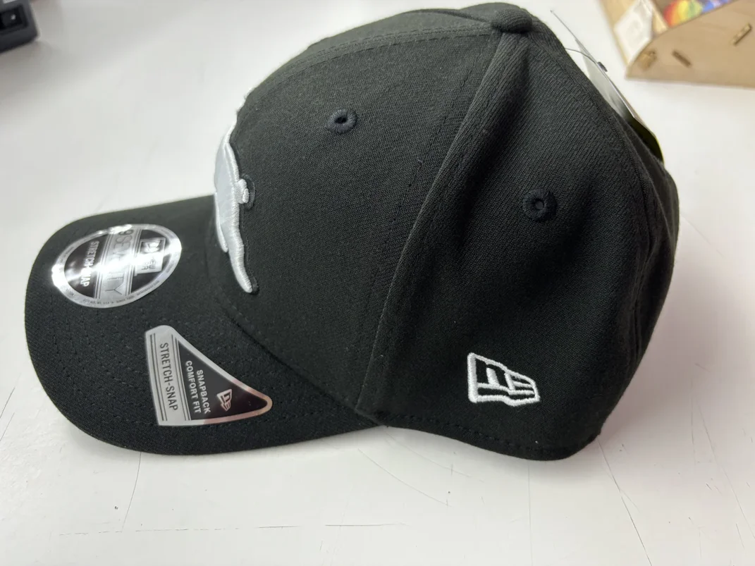 NRL-Rabbitohs-970SS-Snapback-Cap-Black-White-Left.webp NRL Rabbitohs 970SS Snapback Cap Black White Left view