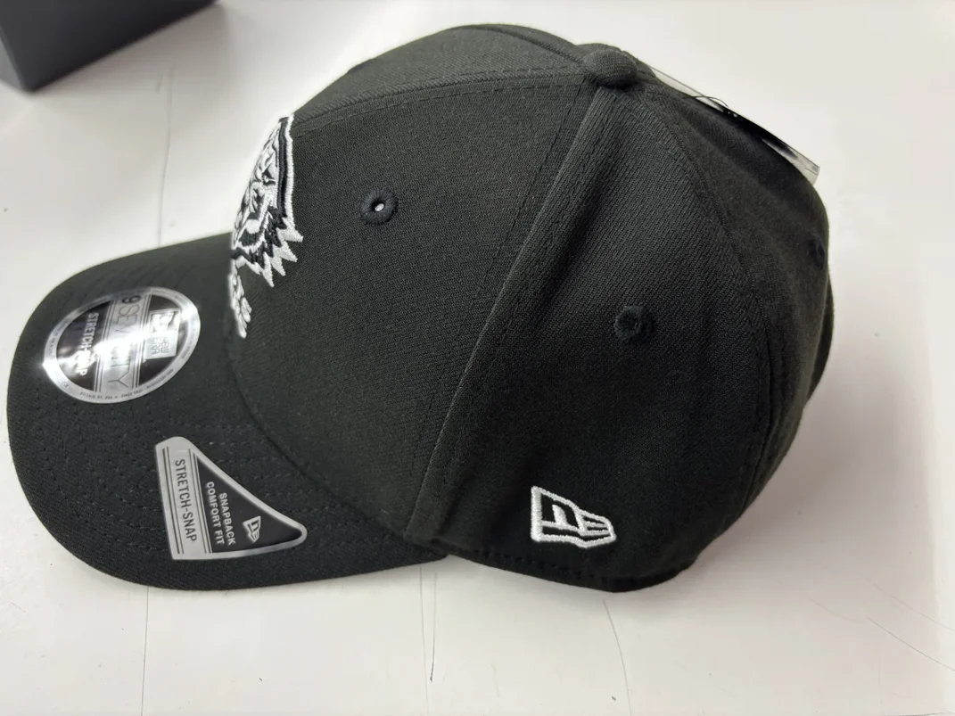 NRL-Tigers-970SS-Snapback-Cap-Black-White-Left.webp NRL Tigers 970SS Snapback Cap Black White Left View