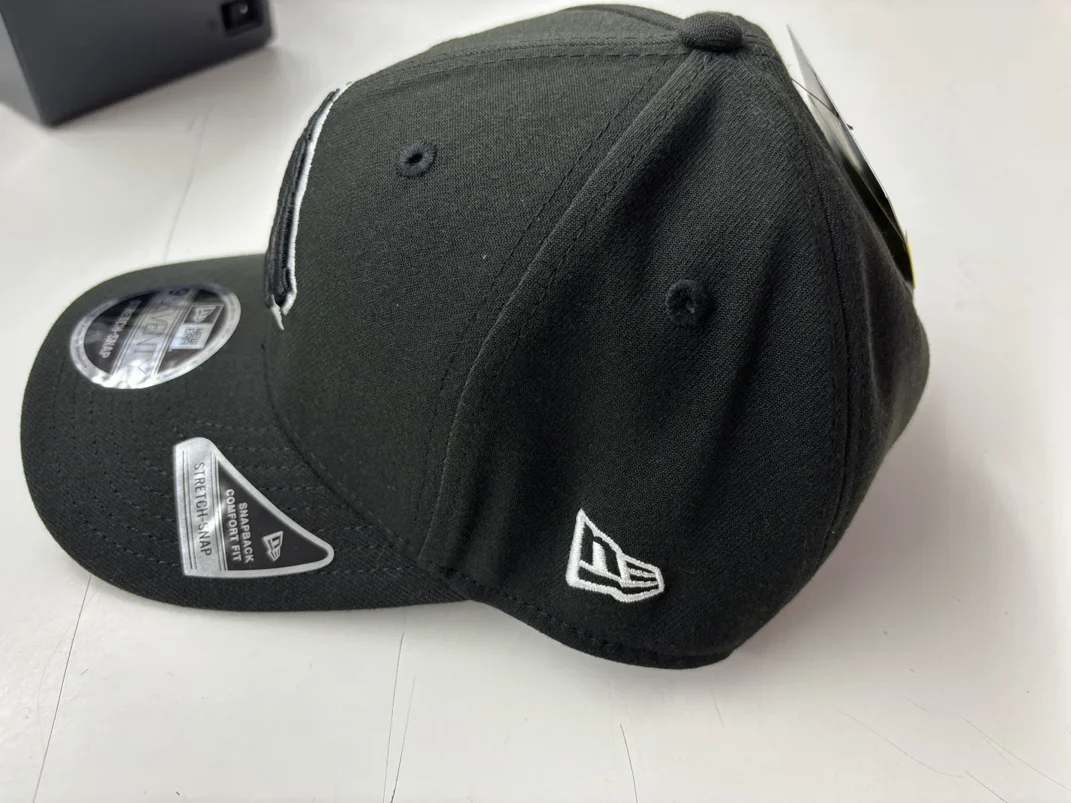 NRL-Broncos-970SS-Snapback-Cap-Black-White-Left.webp NRL Broncos 970SS Snapback Cap Black White Left View